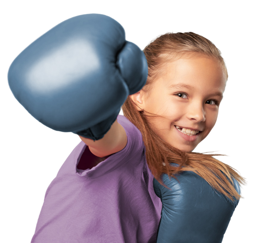 A child standing confidently with boxing gloves