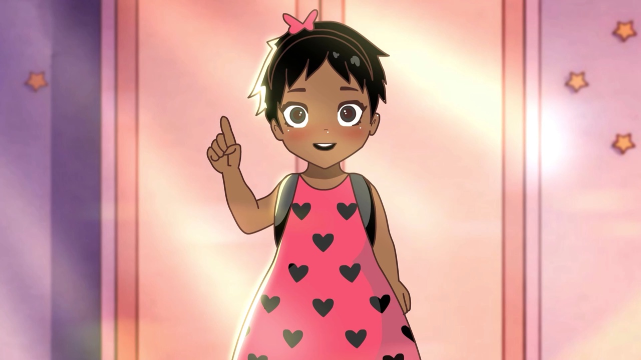 Gigi smiling and raising her hand